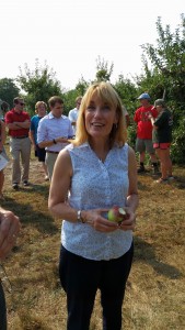 New Hampshire Gov. Maggie Hassan enjoys an apple at Mack's Apples in Londonderry, where she presented a proclamation for New England Apple Day. (Bar Lois Weeks photo)