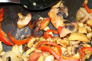 Apple Stir-Fry with onions, peppers, mushrooms, and tempeh. (Russell Steven Powell photo)